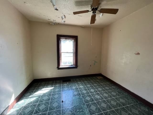 305 153rd Street Calumet City, IL 60409 - Photo 10 of 40 an empty room with a empty space and windows