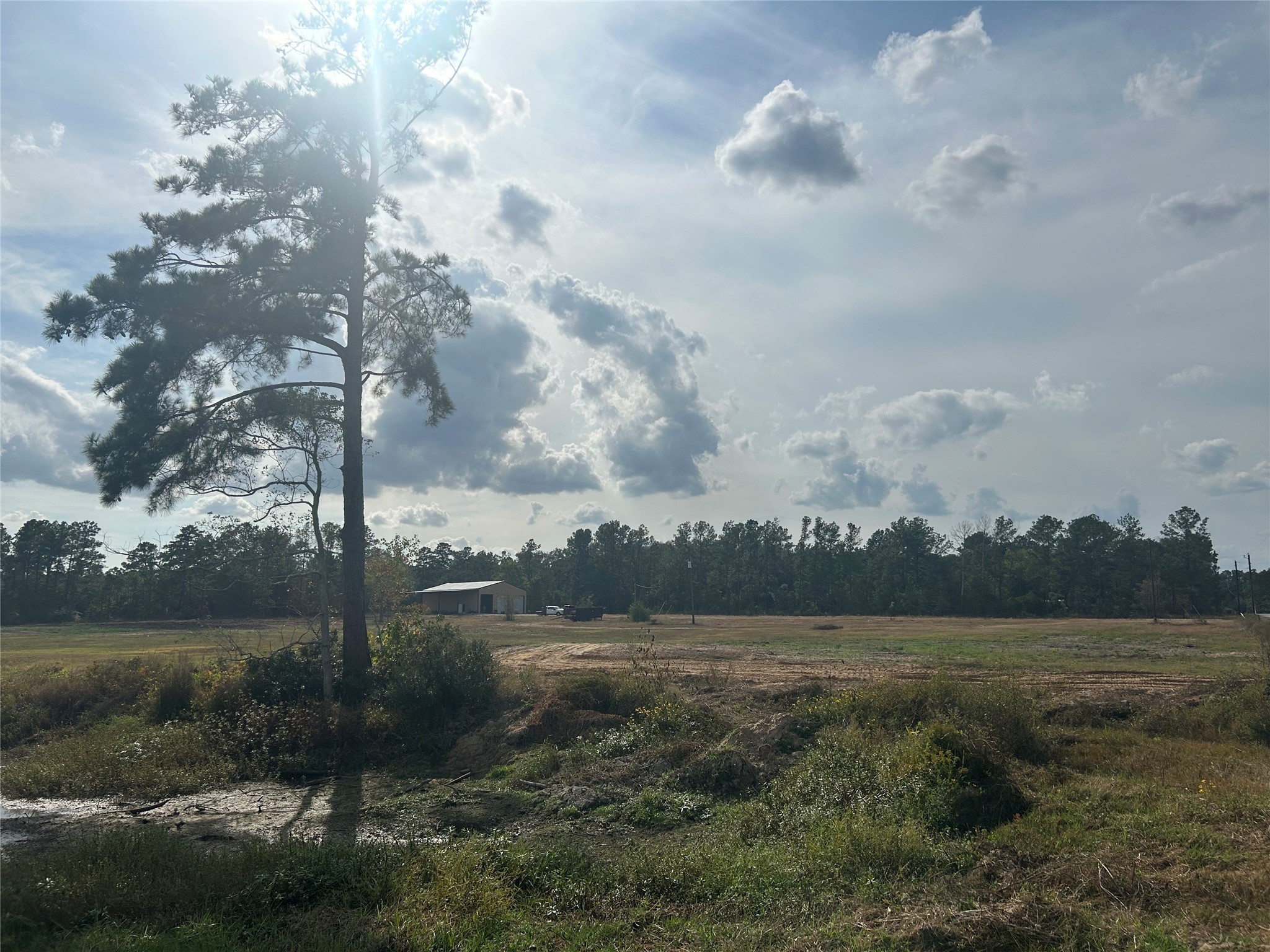 18074 Hill Road Cleveland, TX 77328 - Photo 4 of 19 a view of a lake with houses in the back