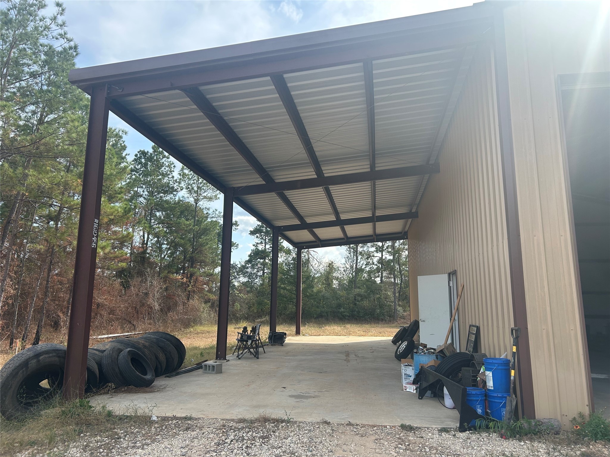 18074 Hill Road Cleveland, TX 77328 - Photo 8 of 19 a view of a porch with furniture and floor to ceiling window