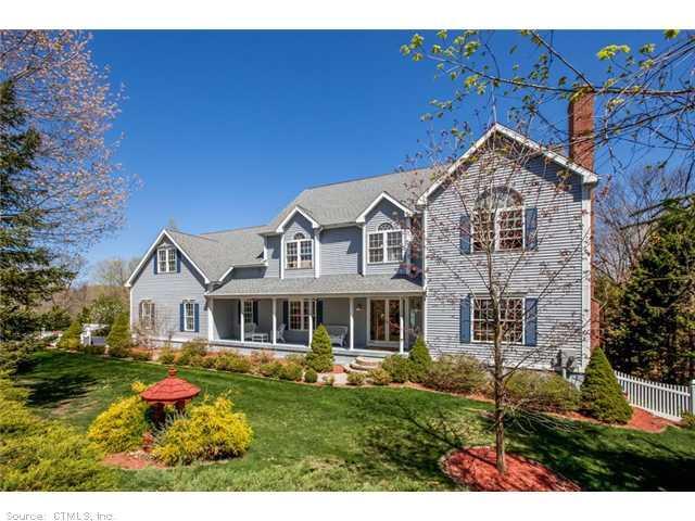 2265 Long Hill Road Guilford, CT 06437 - Photo 1 of 1 a front view of a house with garden