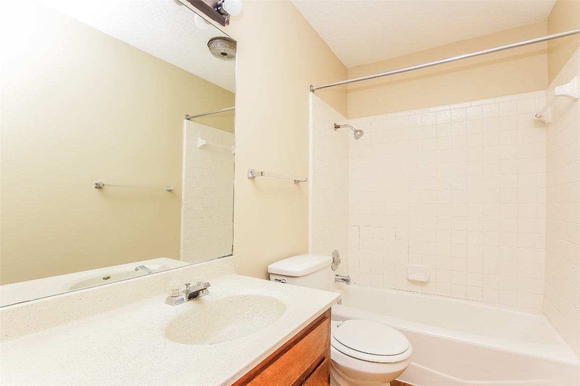 1813 Rawhide Drive Round Rock, TX 78681 - Photo 12 of 16 a bathroom with a sink toilet and shower