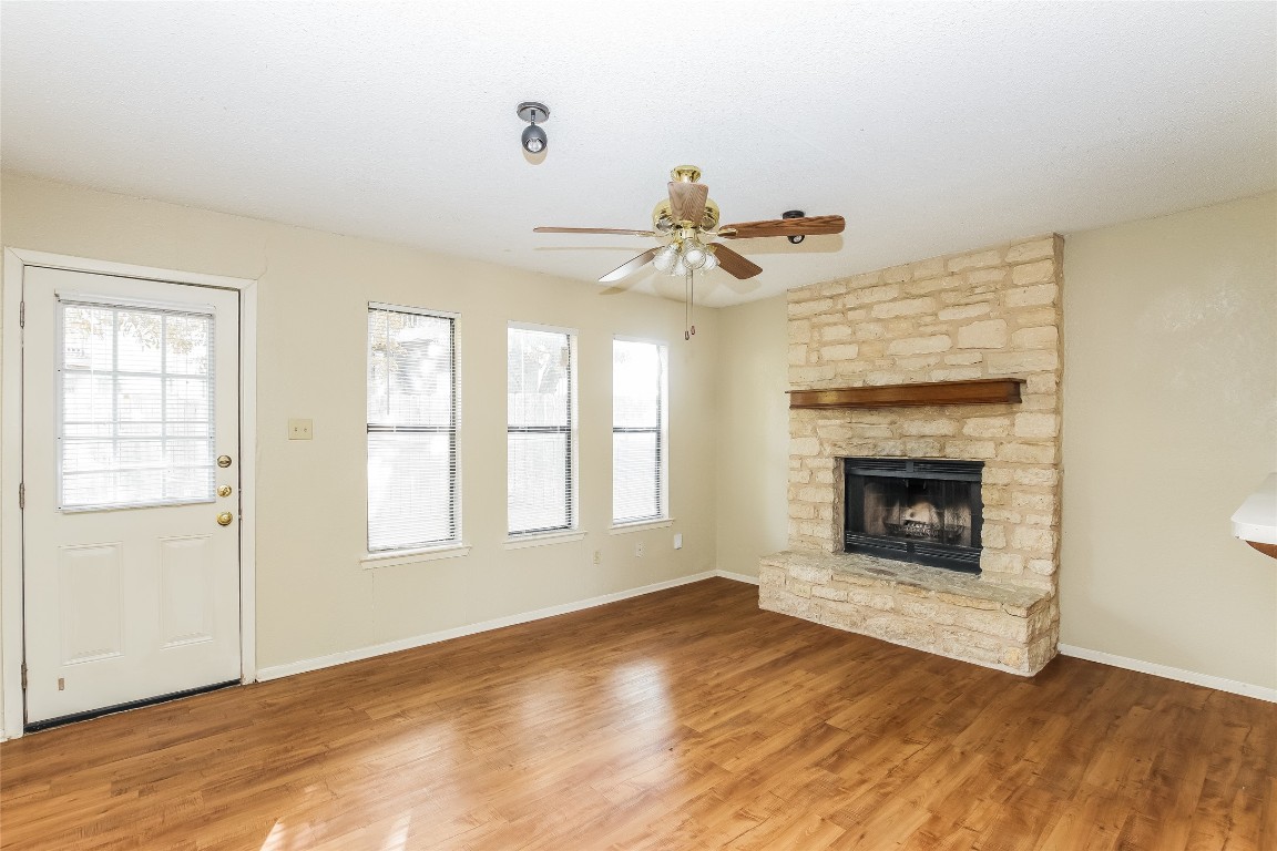 1813 Rawhide Drive Round Rock, TX 78681 - Photo 5 of 16 a view of an empty room with window and fire place