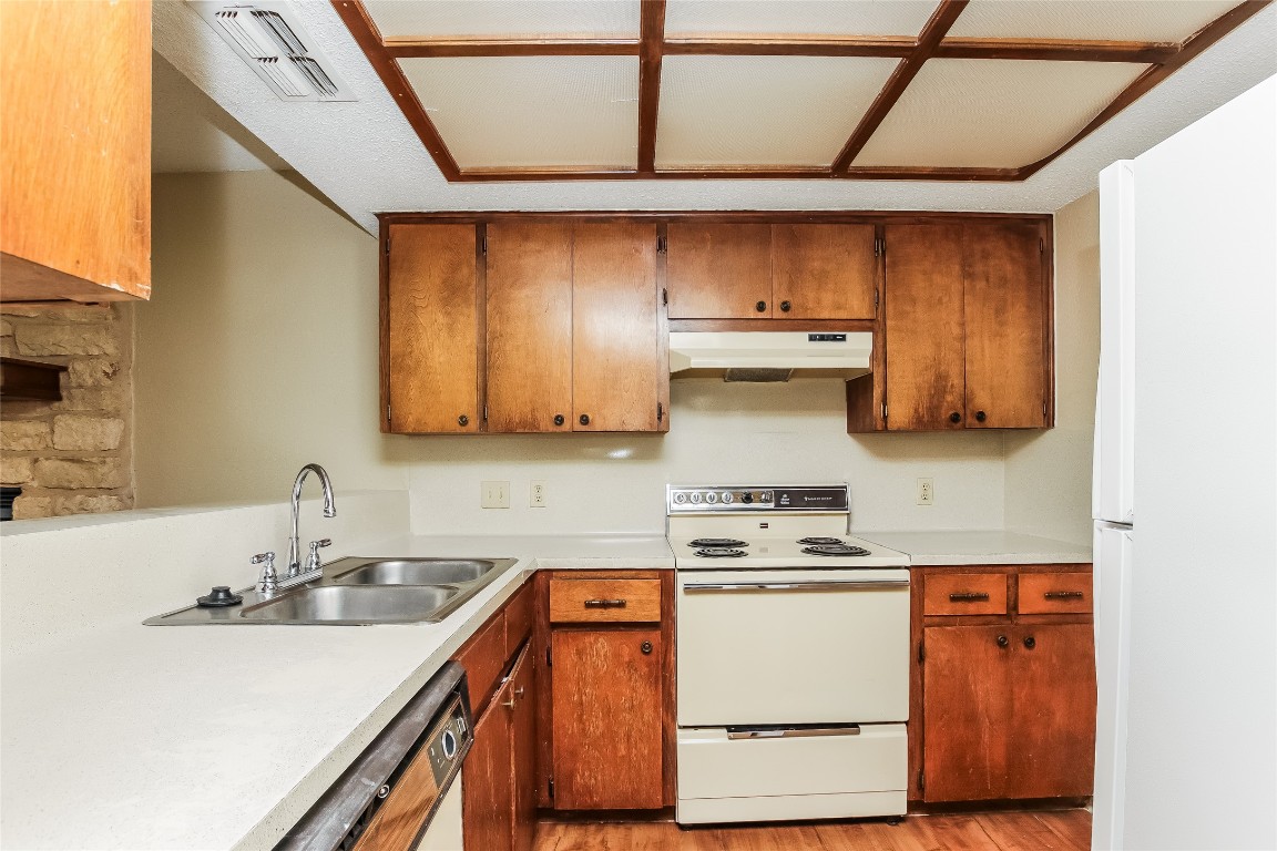1813 Rawhide Drive Round Rock, TX 78681 - Photo 9 of 16 a kitchen with stainless steel appliances a sink and a stove