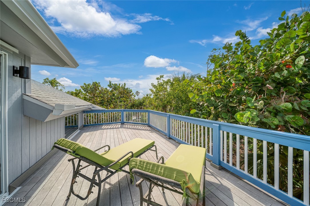 4546 Buck Key Road Sanibel, FL 33957 - Photo 18 of 41 a view of a chairs and table in the balcony