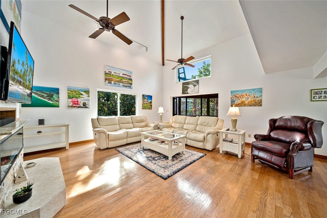 4546 Buck Key Road Sanibel, FL 33957 - Photo 4 of 41 a living room with furniture and a flat screen tv