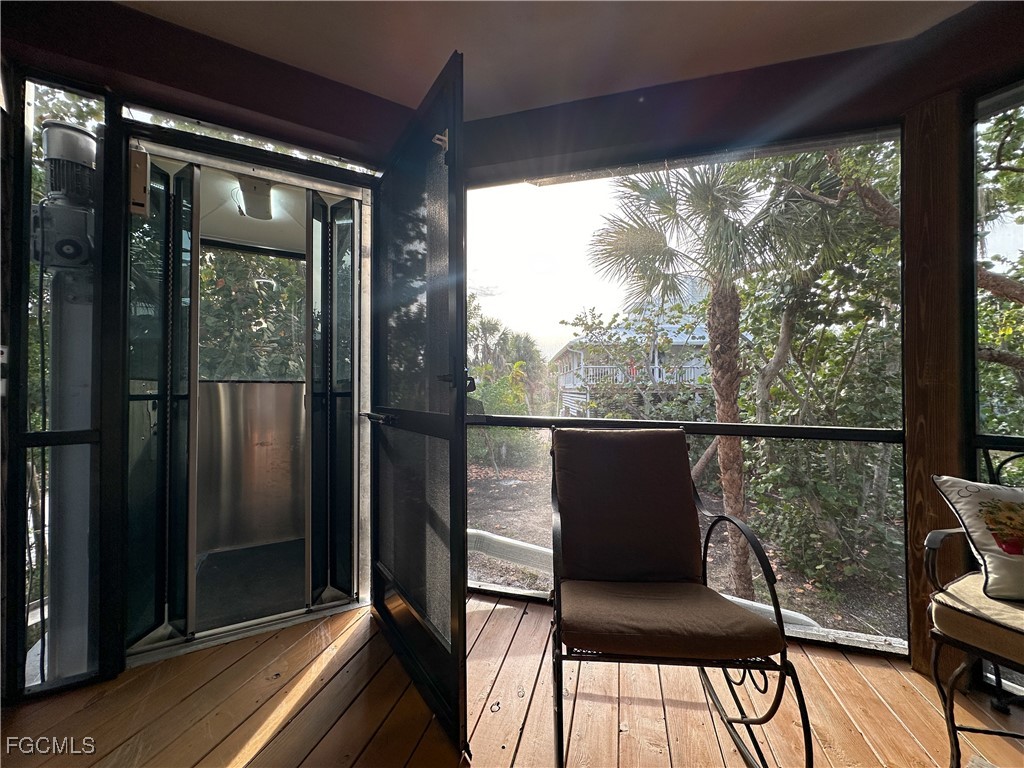 4546 Buck Key Road Sanibel, FL 33957 - Photo 6 of 41 a view of a chair and table in the balcony