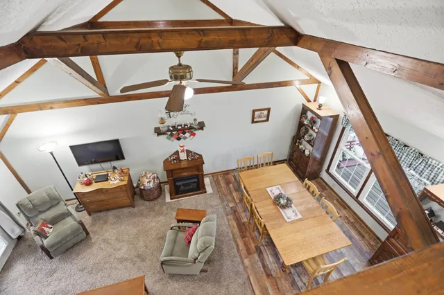 a living room with lots of furniture and a wooden floor