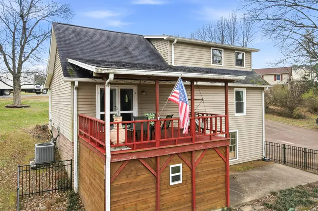 a view of yard with swimming pool and trees