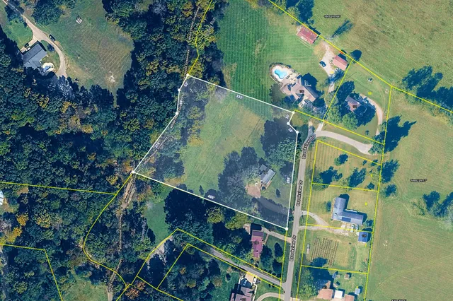 a view of a hallway with paintings on the wall
