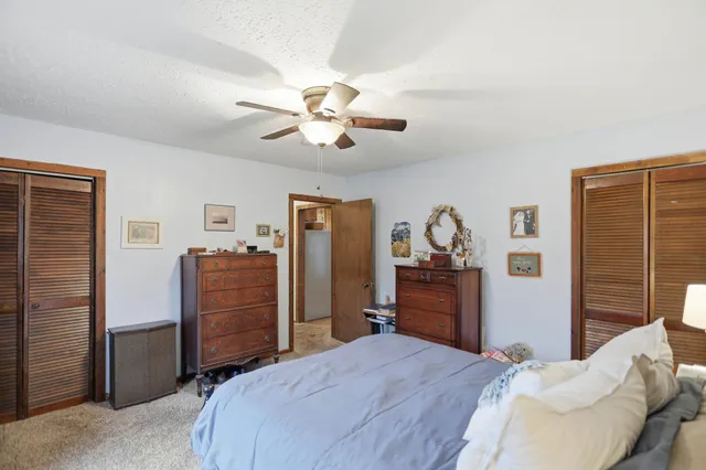 a view of a livingroom with workspace and a couch