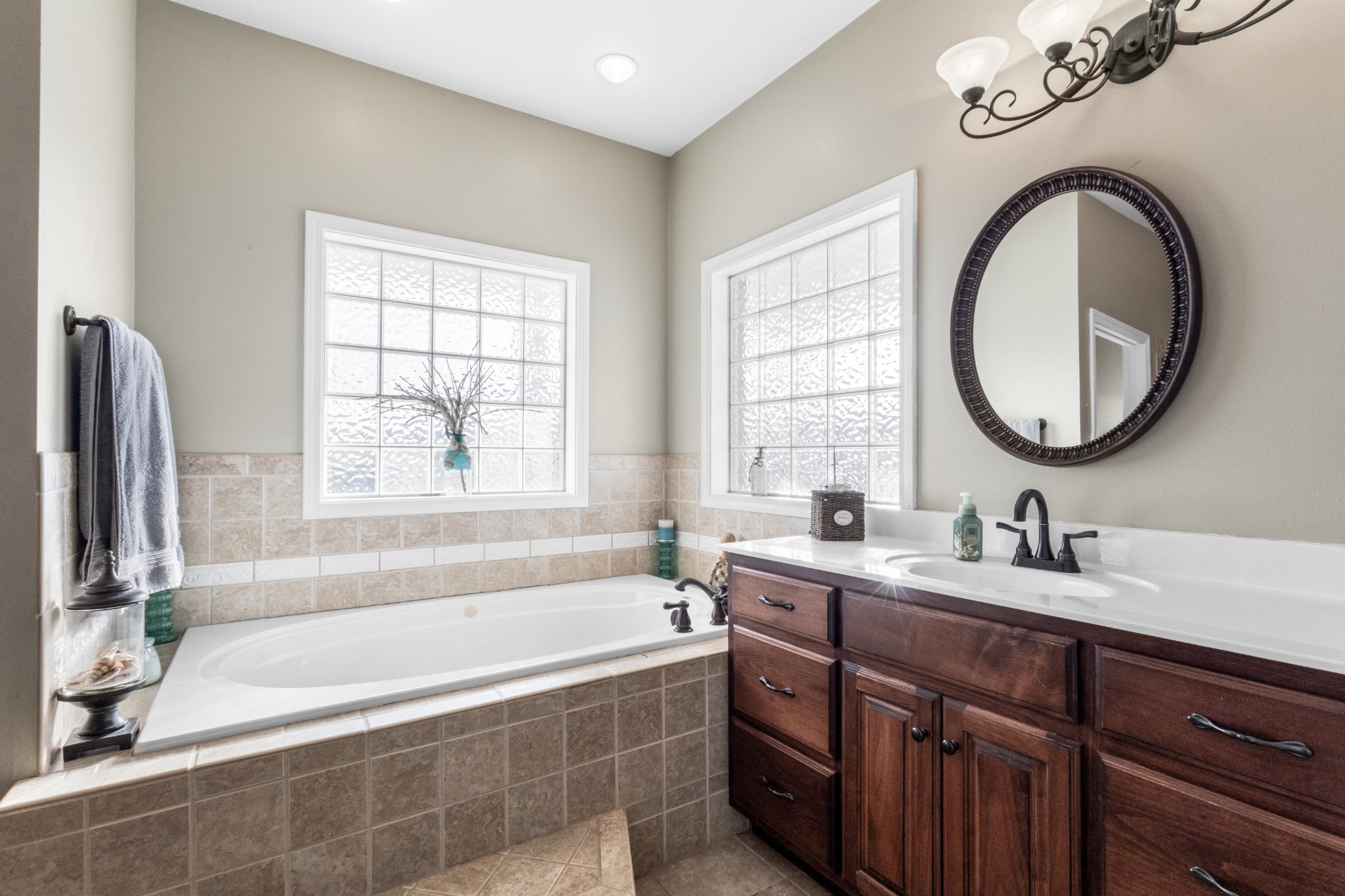 4591 Pineywoods Road Adams, TN 37010 - Photo 30 of 83 a bathroom with a tub sink and mirror