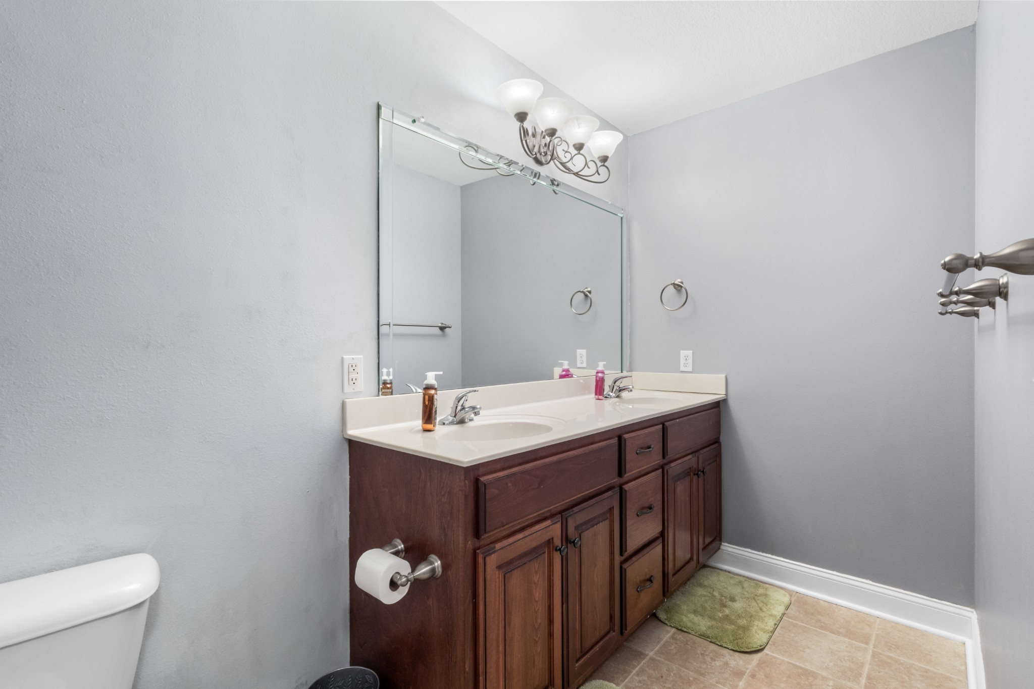 4591 Pineywoods Road Adams, TN 37010 - Photo 35 of 83 a bathroom with a double vanity sink mirror and toilet