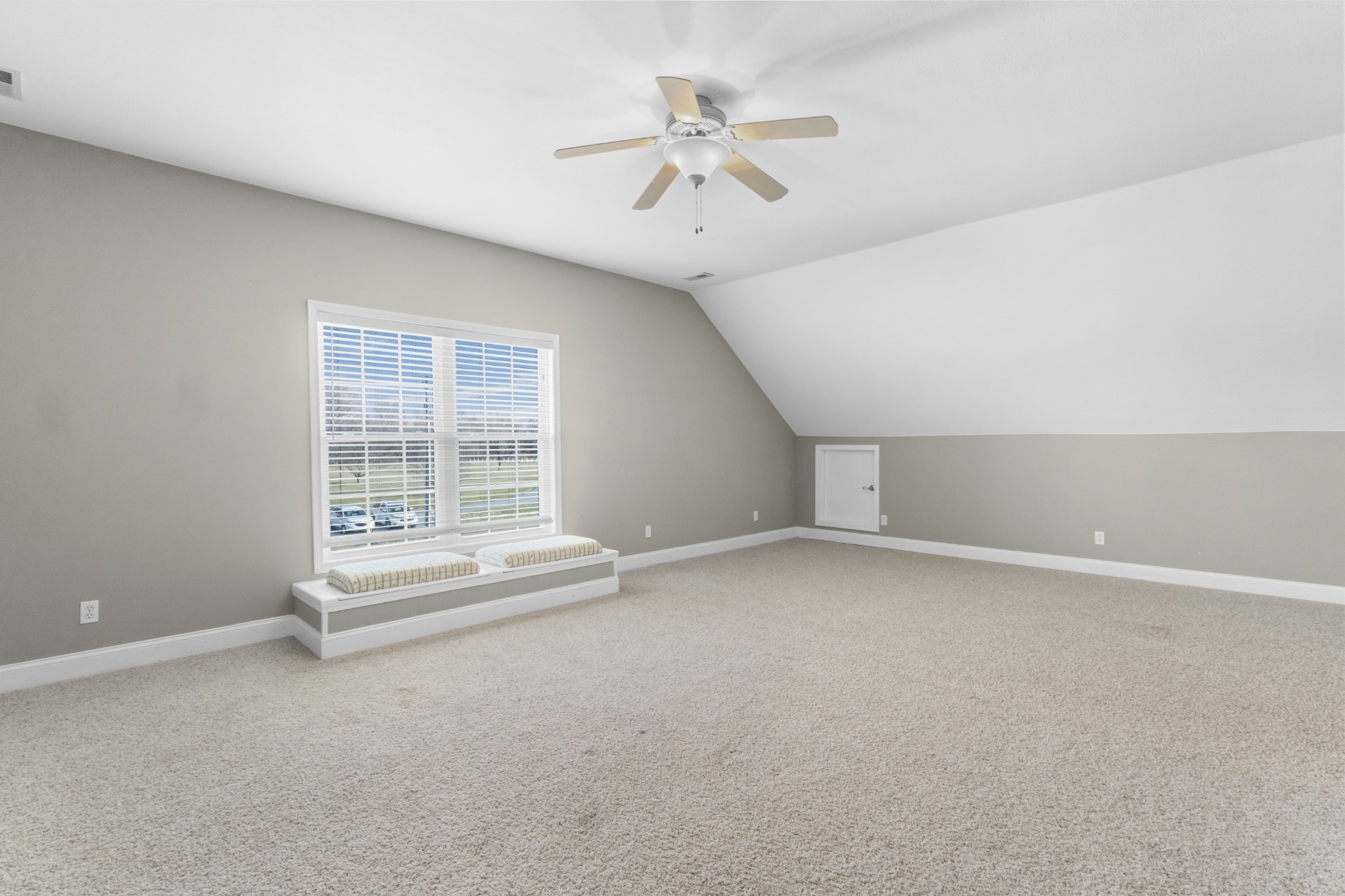 4591 Pineywoods Road Adams, TN 37010 - Photo 37 of 83 an empty room with a ceiling fan and windows