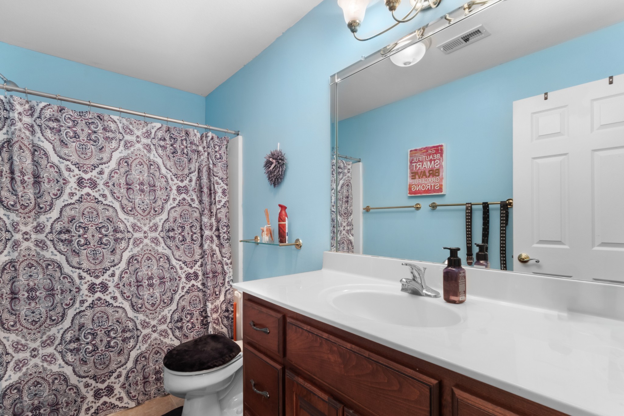 4591 Pineywoods Road Adams, TN 37010 - Photo 40 of 83 a bathroom with a sink a toilet and a mirror