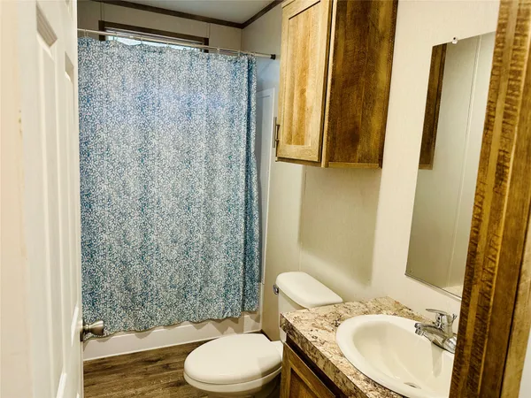 a kitchen with stainless steel appliances a refrigerator sink and cabinets
