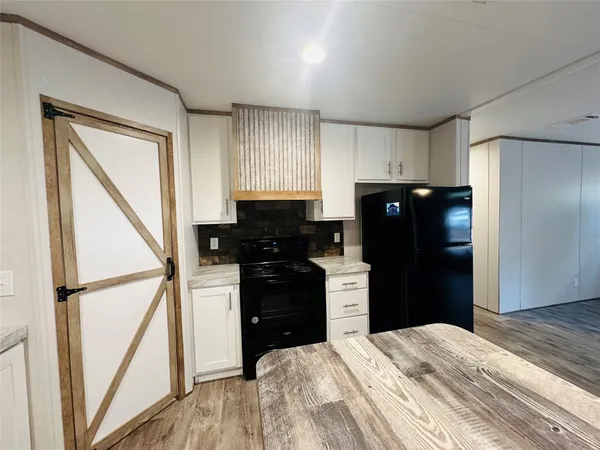 a bedroom with a bed and a table