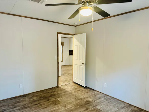 a bathroom with a sink a window and a shower