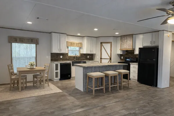 a bedroom with double bed and a chandelier