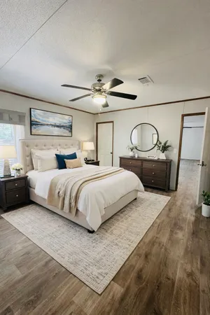 a front view of a house with a tree