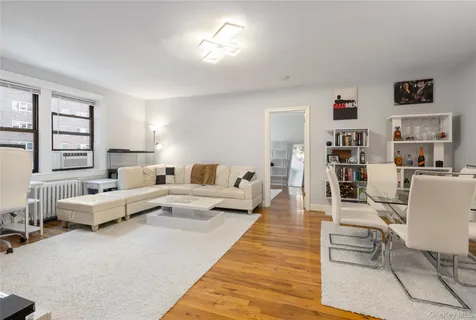 a living room with furniture and a rug