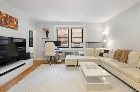 a living room with furniture fireplace and a flat screen tv