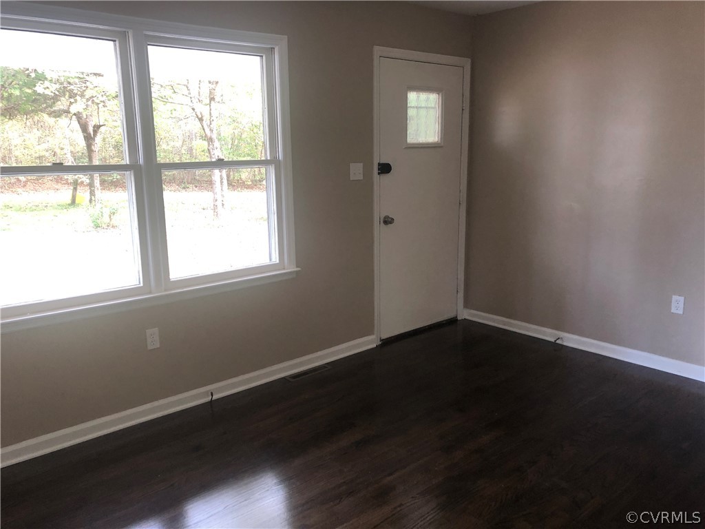 1813 Little Deer Road Alberta, VA 23821 - Photo 14 of 27 an empty room with wooden floor and windows