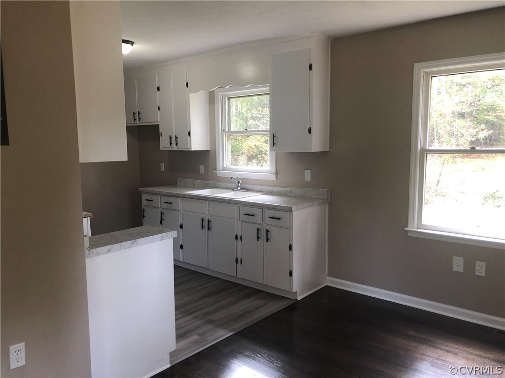 1813 Little Deer Road Alberta, VA 23821 - Photo 15 of 27 a kitchen with cabinets wooden floor and a window