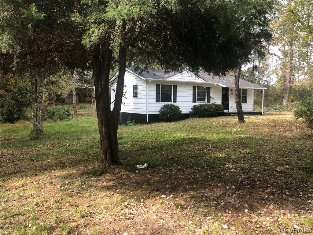 1813 Little Deer Road Alberta, VA 23821 - Photo 2 of 27 a view of a yard in front of a house with large trees
