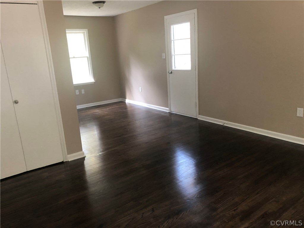 1813 Little Deer Road Alberta, VA 23821 - Photo 3 of 27 an empty room with wooden floor and windows