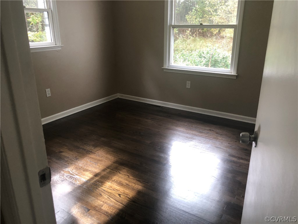 1813 Little Deer Road Alberta, VA 23821 - Photo 10 of 27 a view of empty room with wooden floor and windows