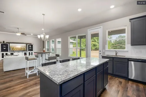 a kitchen with granite countertop lots of counter top space