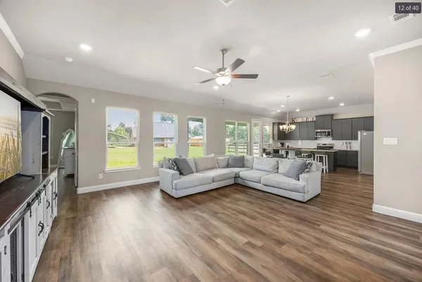a living room with furniture and a large window