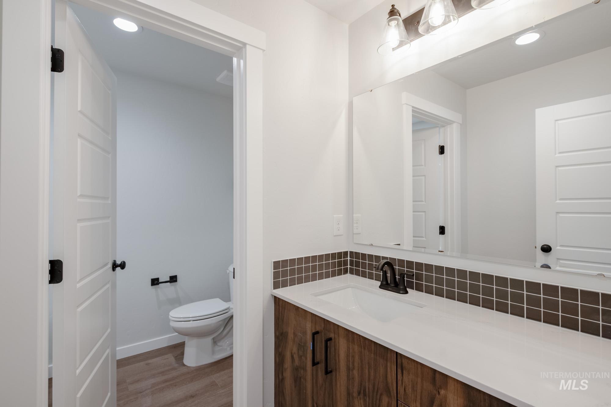 2135 South Border Way Meridian, ID 83642 - Photo 17 of 24 Bathroom with recessed lighting, vanity, and light wood-style floors