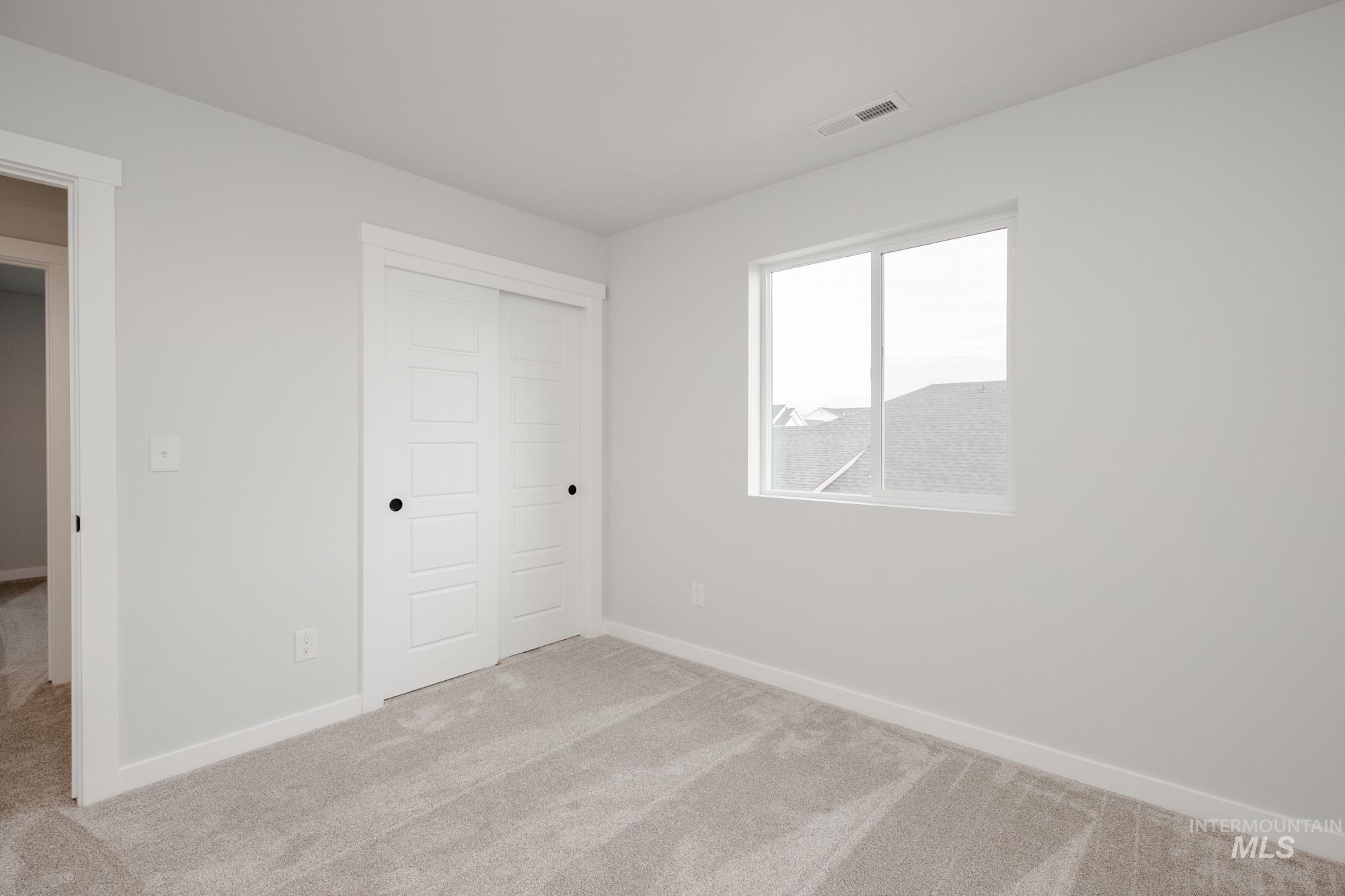 2135 South Border Way Meridian, ID 83642 - Photo 20 of 24 Unfurnished bedroom with carpet floors and a closet