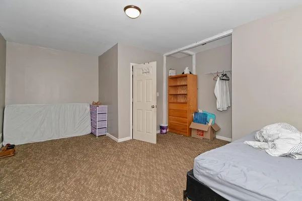 a room with furniture and a closet