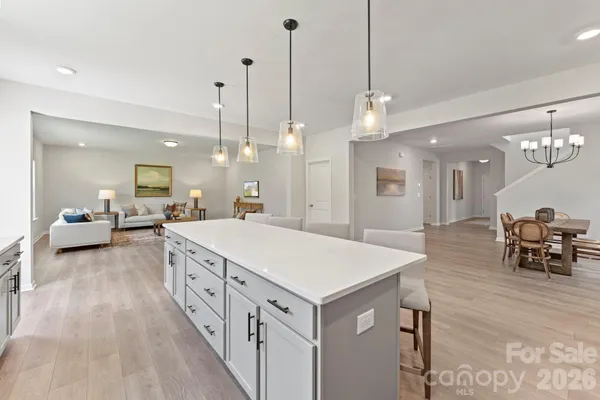 a large room with kitchen view