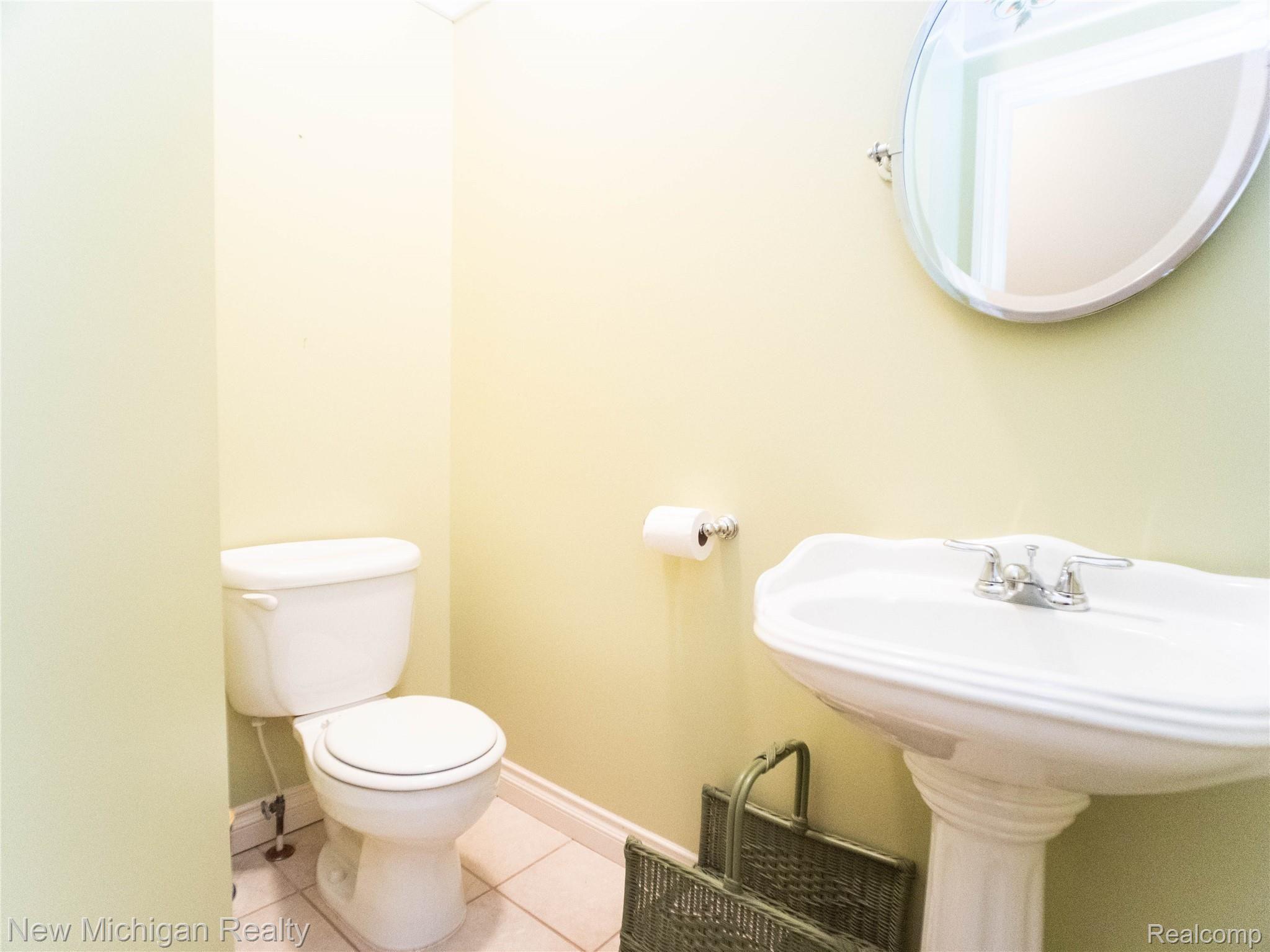 724 Lakeville Road Leonard, MI 48367 - Photo 25 of 31 P1011103 half bath.jpg