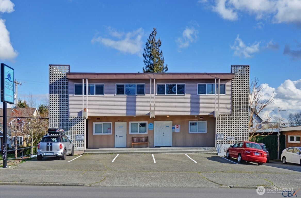 a front view of a house with parking space