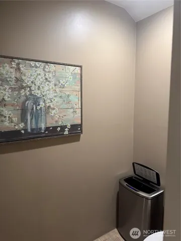 a bathroom with a sink toilet and a mirror