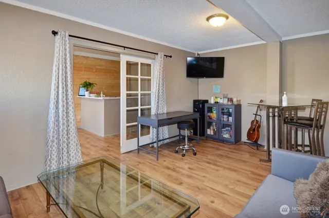 a view of a livingroom with furniture and a flat screen tv