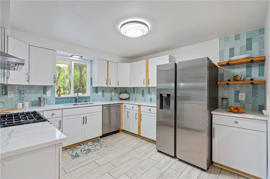 3326 New England Road West Mifflin, PA 15122 - Photo 12 of 46 a kitchen with stainless steel appliances granite countertop a refrigerator sink and stove