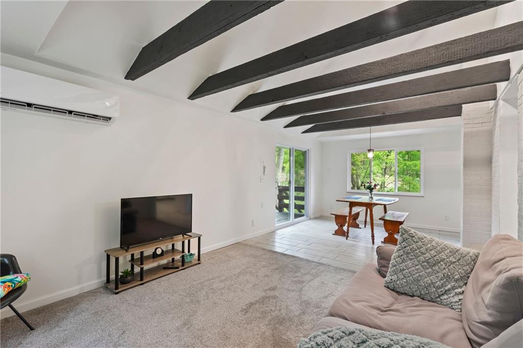 3326 New England Road West Mifflin, PA 15122 - Photo 18 of 46 a living room with furniture and a flat screen tv