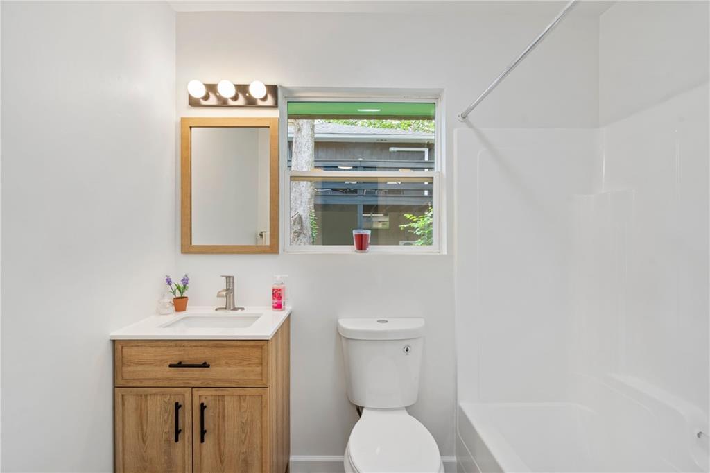3326 New England Road West Mifflin, PA 15122 - Photo 35 of 46 a bathroom with a toilet sink and a window