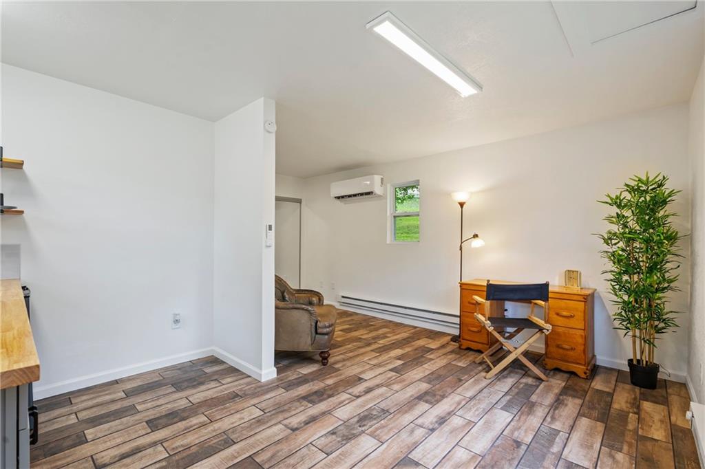3326 New England Road West Mifflin, PA 15122 - Photo 36 of 46 a view of a room with wooden floor lounge chair and windows