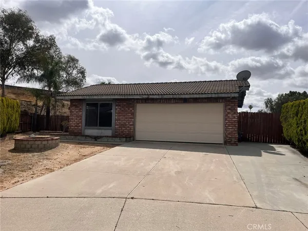 a front view of a house with a garage