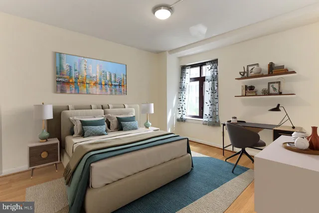 a bedroom with a bed and a couch