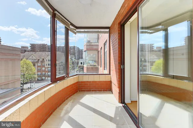 a bathroom with a large tub and shower