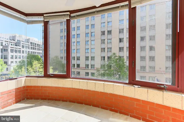 a bathroom with a large window and a bathtub