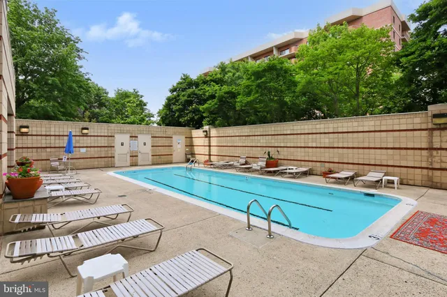 a view of a backyard with sitting area