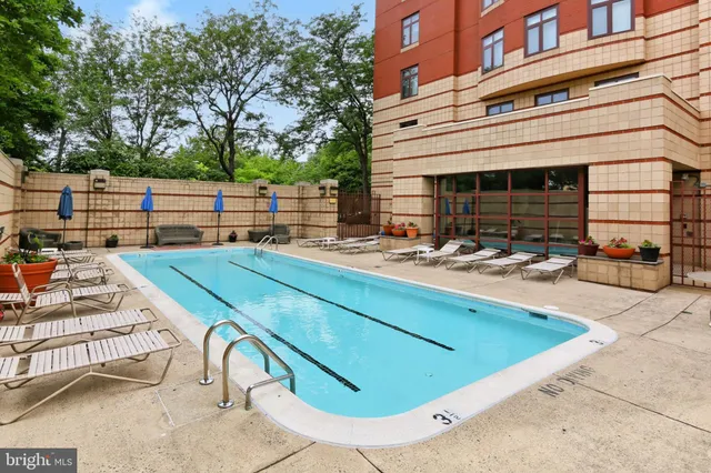 a view of a patio with chairs and plants